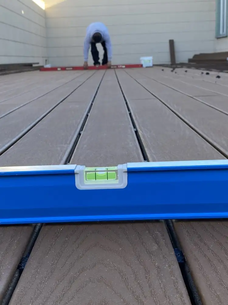 Levels set on newly installed deck boards