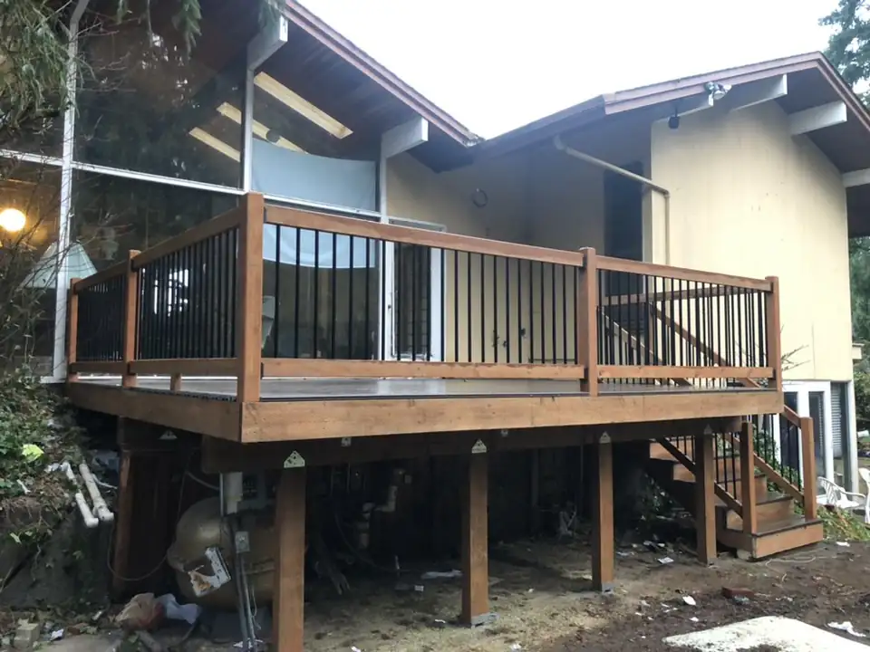 Elevated deck with visible posts and black railing